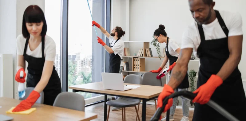 people-cleaning-service-cleans-tables-floor-panoramic-windows