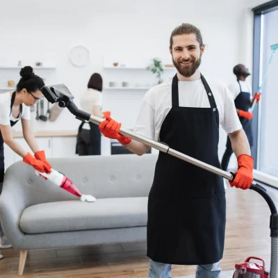 portrait-bearded-cleaner-from-cleaning-service-holding-vacuum-cleaner